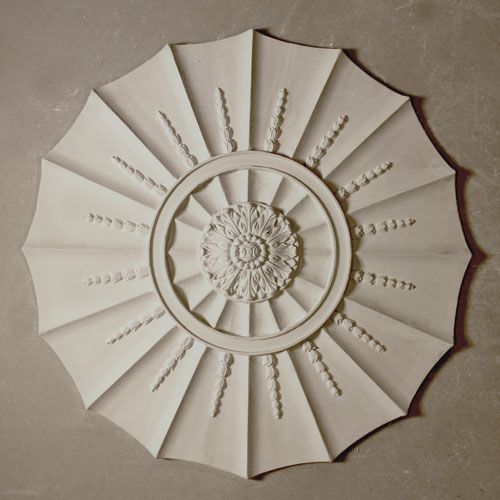 CR8 Adams Design Ceiling Rose is a large hand cast fibrous plaster rose with open flutes overlaid with leaf enrichment with ornate central boss. Dimensions: 600mm